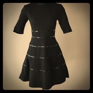 A-line black dress with patent leather lines